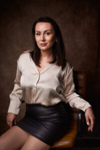 Business woman sitting on leather chair